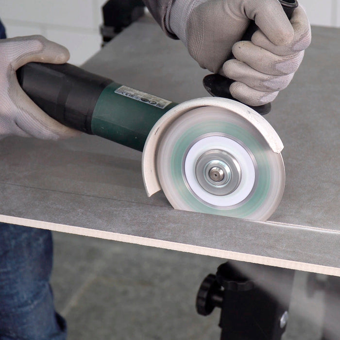 Tile installer using Perfect diamond blade on porcelain tile with clean edge