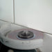 Worker using Cleaner 4 inch diamond blade on angle grinder to clean grout