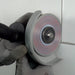 Worker using Cleaner 4 inch diamond blade on angle grinder to clean grout