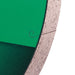 Close-up of a green and brown material with a circular detail on a white background