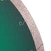 Close-up of a circular object with a textured edge and green center.
