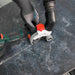 Professional tiler using ROLLER 76 Cutting Guard for dust-free ceramic cutting