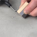 Professional repairing cracked ceramic tile with TileRepairKit