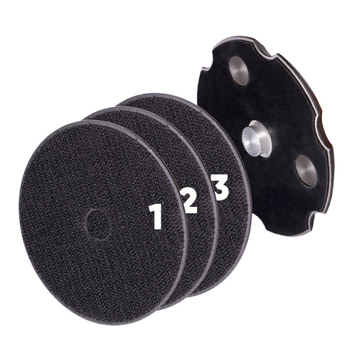 A set of black polishing discs numbered 1, 2, 3, along with a black angle grinder base with a silver-colored knob on top.